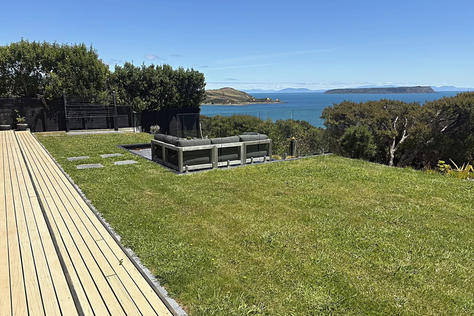 Lawn and timber deck above the sea, Camborne