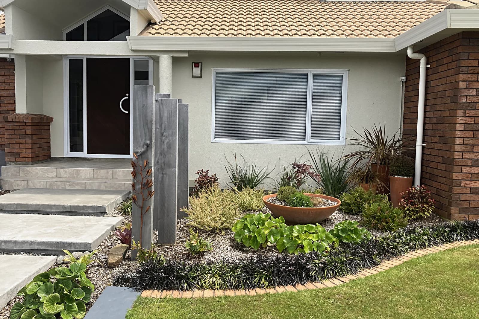 Front garden planting with curved edging, Camborne