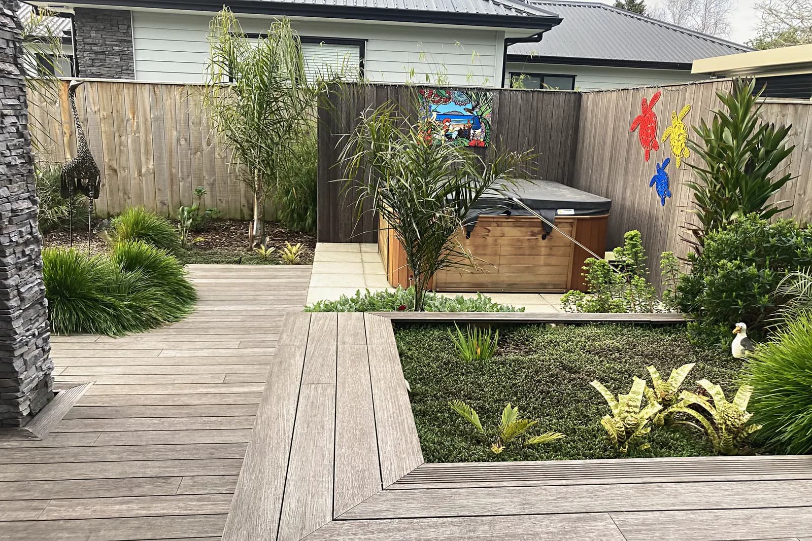 Timber deck with built-in seating and a spa pool, Otaki