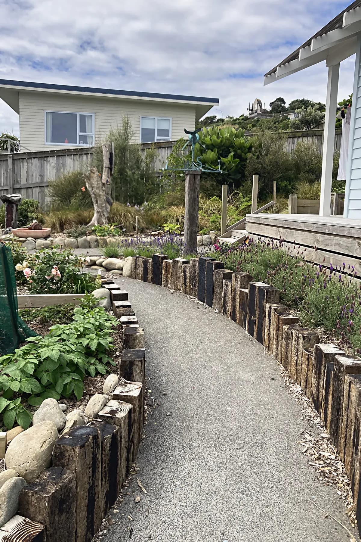 Gravel path edged in upright sleepers, Titahi Bay