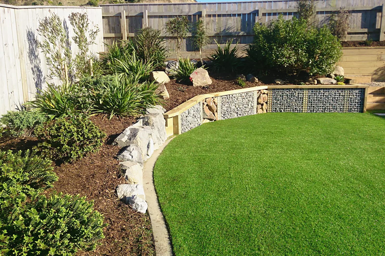 Curved lawn edged by timber and gabion retaining, Whitby
