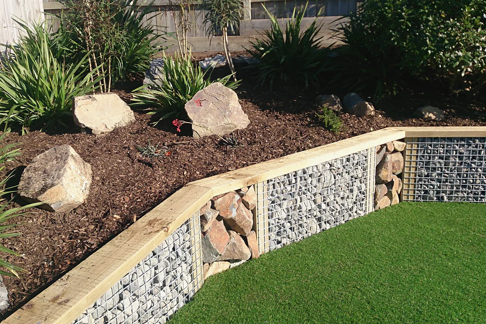 Timber and gabion retaining with planting above, Whitby