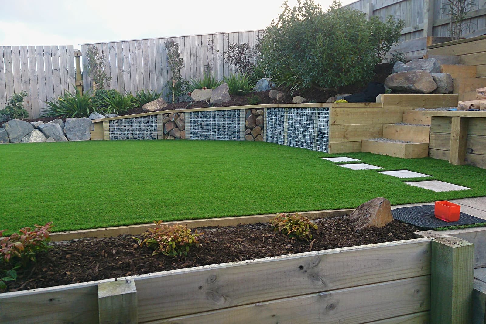 Lawn, retaining wall and timber steps in a back garden, Whitby